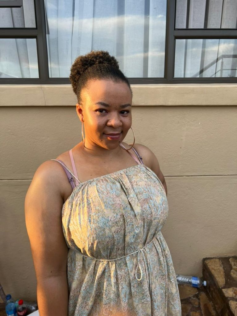 lady smiling in front of the camera